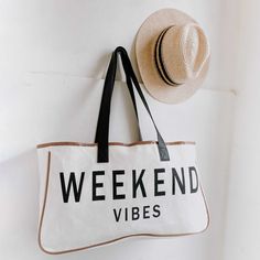 The Weekend Getaway Tote Bags call for two plane tickets and a cocktail! We know you are going to love them as much as we do. Materials: Canvas, PU Leather, Cotton 100% cotton canvas tote bag PU leather handles 20"L x 5"W x 11"H 11.2 oz Travel Canvas, Canvas Totes, Printed Handbags, Brown Handbag, Be Happier, Spring Summer 2023, Weekend Vibes, Classic Shoes, Beach Tote Bags