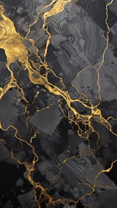 an abstract black and gold marble pattern with some yellow highlights on it's surface