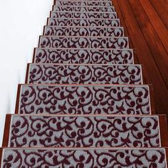 a set of carpeted stairs with designs on them