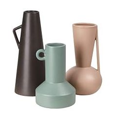 three different colored vases sitting next to each other