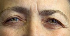 an older woman's eyes with wrinkles