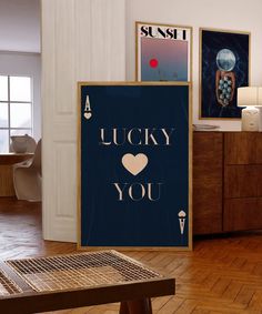 there is a poster that says lucky you next to a coffee table in the living room