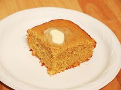 a piece of cornbread on a white plate