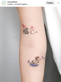 two small tattoos on the arm of someone's left arm, one with an animal and