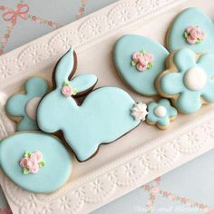 decorated cookies in the shape of rabbits and flowers