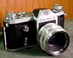 an old camera sitting on top of a table