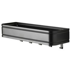 a black plastic planter with wheels on the sides and bottom, is shown in front of a white background