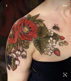 a woman's shoulder with flowers and bees on it