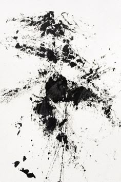 a black and white painting with paint splattered on it's surface,