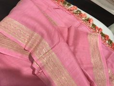 A beautiful handloom muga silk dupatta in a lovely shade of pink with beautiful zari borders in kadwa work and multicolour tassels, this one will surely add an elegant touch to your wardrobe. Colour may vary depending upon the lighting and individual device settings. Dry clean only All sales are final  Handloom products may have some irregularities unlike power loom products. Pink Raw Silk Saree With Cutdana, Pink Slub Silk Saree For Festive Occasions, Pink Slub Silk Traditional Wear With Self Design, Pink Slub Silk Saree For Diwali, Pink Handloom Raw Silk Traditional Wear, Handloom Pink Raw Silk Traditional Wear, Pink Tussar Silk Traditional Wear With Cutdana, Pink Raw Silk Saree With Dupatta, Pink Tissue Silk Traditional Wear With Sheer Dupatta