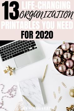 a desk with christmas decorations and a laptop on it that says 13 life - changing organization printables you need for 2020