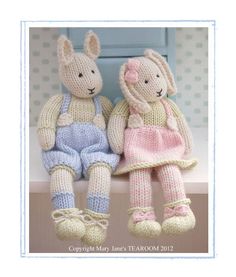 two knitted rabbits sitting next to each other