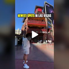 a man standing in front of a building with the words news spots in las vegas