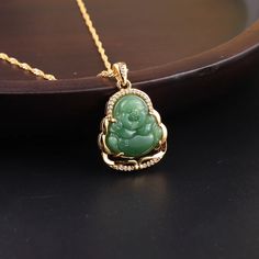 Green Jade Buddha represents Peace, prosperity, positive energy, and good health. Beautiful green jade stone gold plated necklace. Trendy fashion jewelry. 18.11 inch gold plated. Fashion Buddha necklace. Buddha necklace. Jade green necklace. Stone necklace. Green Buddha necklace. Jade necklaces. Buddha gold necklace. Buddha fashion. Fashion jewelry. Fashion gold necklace. New. Trending fashion. Fashion trends. Trendy jewelry. Gold jewelry. Gold plated necklace. Women’s gifts. Gifts. High quality Gold Jade Pendant Necklace, Gold Jade Jewelry For Good Luck, Gold Jade Crystal Necklaces As Gifts, Gold Jade Crystal Necklace As Gift, Gold Jade Necklace Gift, Gold Jade Crystal Necklace Gift, Jade Buddha Necklace, Green Buddha, Buddha Gold