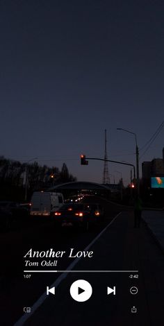 an image of a city street at night with traffic lights and the words another love on it