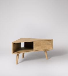 a wooden table with two drawers on one side and measurements for the top shelf below