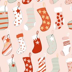 a pink background with christmas stockings and socks on it's sides, all in different colors