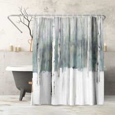 a shower curtain with white and blue paint on it, next to a bathtub