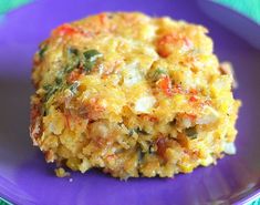 a close up of food on a plate with words in the background that reads mardi gras crawfish cornbread