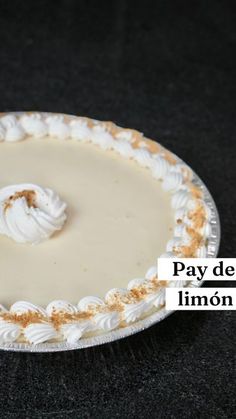 a pie sitting on top of a table covered in frosting