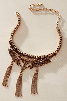 Finish off your look with this eye-catching choker, featuring gemstone detailing and dangling tassels with a lobster clasp closure. | Eloise Choker by Free People in Gold Fringe Tassel Necklace For Party, Party Necklaces With Tassels, Elegant Metal Tassel Necklace For Parties, Metal Tassel Necklace For Party, Elegant Tassel Necklace With Fringe For Party, Chic Tassel Necklace For Party, Gold Topaz, Choker Collar, Silver Crystal