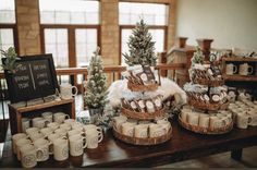 the table is set up with coffee cups and mugs for guests to drink from