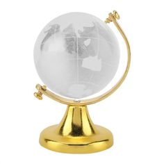 a white and gold globe on a stand