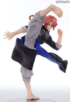 an anime figurine is posed on a white surface with his arms spread out