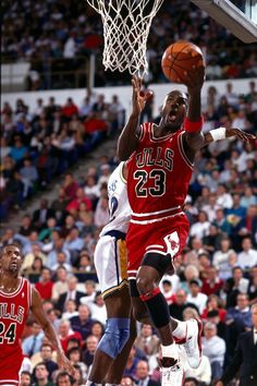 a basketball player jumping up to dunk the ball