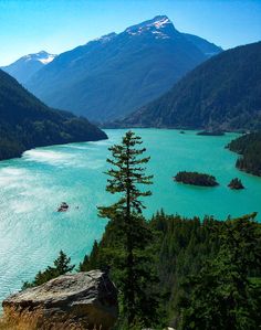 a lake surrounded by mountains and trees