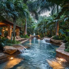 an outdoor pool surrounded by palm trees and water features a waterfall that flows into the pool