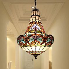 a light fixture hanging from the ceiling in a hallway