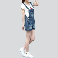 Fashion-forward and effortlessly cool. we present the 2023 Summer Collection ââ‚?the 90s-inspired denim romper! Crafted with premium quality fabric. this medium wash masterpiece is sure to be your go-to piece for the season.Why You'll Love ItCombining sleek slim fit with a classic denim fabric. this romper is a must-have for those looking to make a statement. Flaunt its edgy distressed pattern. pockets. and suspenders closure with pride!Key Highlights: A '90s Vibe: Inspired by the iconic grunge Jean Overall Shorts, 90s Style Jeans, Shorts For Ladies, The 90s Fashion, Jean Romper, Rompers Online, Jeans Overall, Denim Patterns, Oversized Denim Jacket