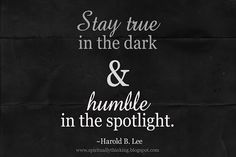 a black and white photo with the words stay true in the dark and humble in the spotlight