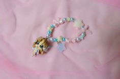 Let everyone see just how magical you are with the cutest coordinate you can dream of!  This is a handmade Symphogear inspired charm bracelet using an authentic Serena figurine turned charm straight from Japan! While this is a new bracelet using new beads and cord, the charm itself is second hand. Please buy knowing there may be some scuffs, chips, and general aging on the charm itself. However, all charms have been disinfected and cleaned to the best of my ability and are happy to serve a new l Kandi Ideas, Bracelet Keychain, New Bracelet, Kandi Bracelets, Cute Bracelets, Japanese Fashion, Arm Band, The Cutest, Free Gifts