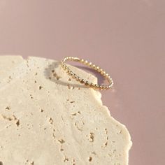 Elevate your style with our handcrafted 14k gold-filled stacking ring. Each ring is meticulously crafted, ensuring that every piece carries the artistry of handmade excellence. The result? A one-of-a-kind ring, as unique as you. This can be your everyday ring. Handcrafted in USA Sold by one ring DETAILS: Material: 14/20 Gold filled Dimensions: Width 1.4mm Note: As each piece is totally handcrafted dimensions and shapes can slightly vary ensuring no two are exactly alike. Extraordinary Jewelry, Dot Ring, Everyday Ring, Gold Bond, Everyday Rings, One Ring, Oils For Skin, Stacking Ring, Gold Filled Jewelry