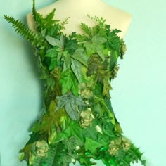 a dress made out of leaves and flowers