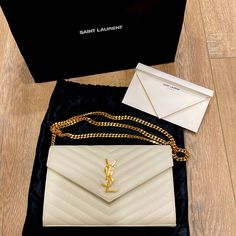 Saint Laurent Clutch. Ivory W/ Gold Hardware. Beautiful, Excellent Condition. No Flaws No Scratches. Comes With Receipt & Dustbag. Saint Laurent Clutch, Saint Laurent Bags, Chain Wallet, Saint Laurent Bag, Wallet Chain, Bags And Accessories, Cream White, Ysl Bag, Gold Hardware