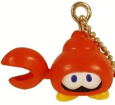 an orange keychain with a cartoon character on it's face and eyes