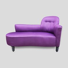 a purple leather chair with black legs on a gray background, it appears to be in the style of art deco