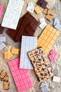 several different types of chocolates are laid out on the table