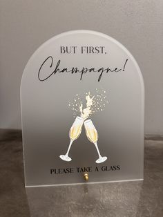 an acrylic sign that says, but first champagne please take a glass on it