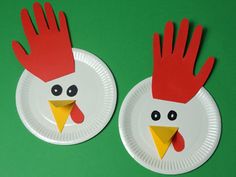 two paper plates with red and white roosters on them, one is made out of construction paper