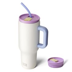 a white and purple coffee cup with a blue lid next to a pink sippy cup