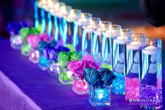 many candles are lined up on a table