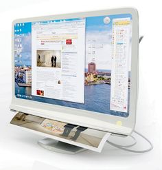 a computer monitor with a magazine on the screen