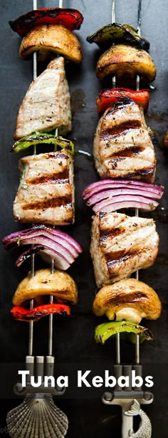 several grilled meats and vegetables on skewers