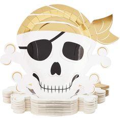 a skull with gold hair and sunglasses on top of stacks of paper plates