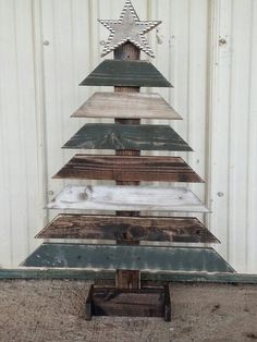 a christmas tree made out of wooden planks