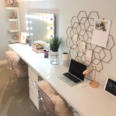 a white desk topped with a laptop computer